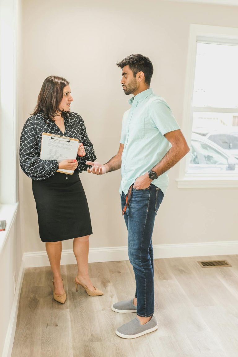 Man and Woman Holding White Paper